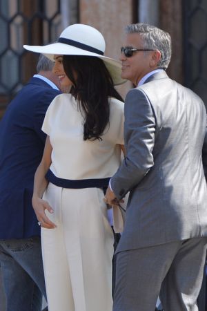 White suit and hat - George Clooney and Amal Alamuddin at the signing the official wedding register.jpg